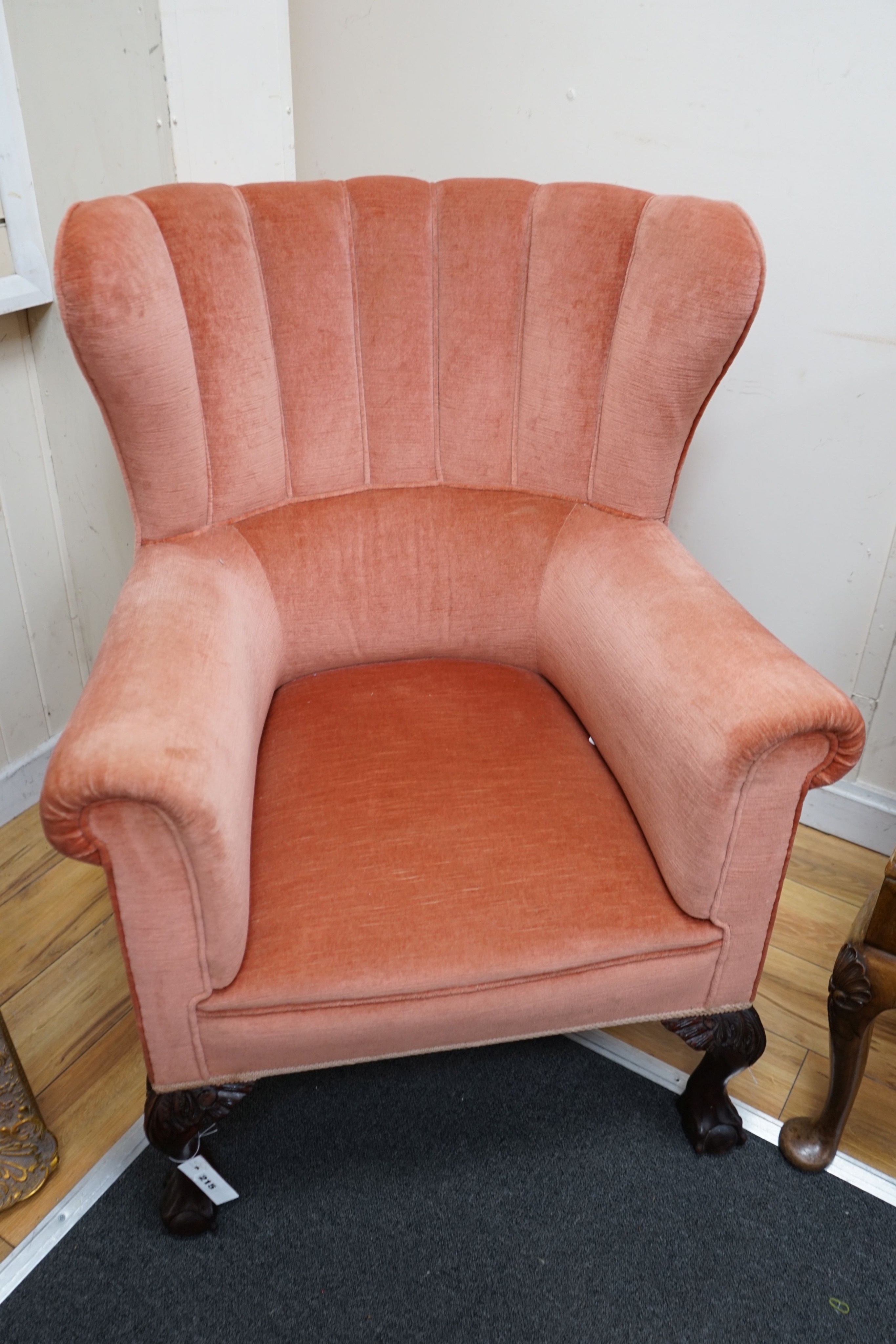A George III style upholstered tub frame wing armchair, width 77cm depth 75cm height 100cm
